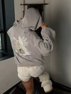 Kapuzenpulli mit Engelsflügel-Print | Urbaner Style mit romantischem Twist