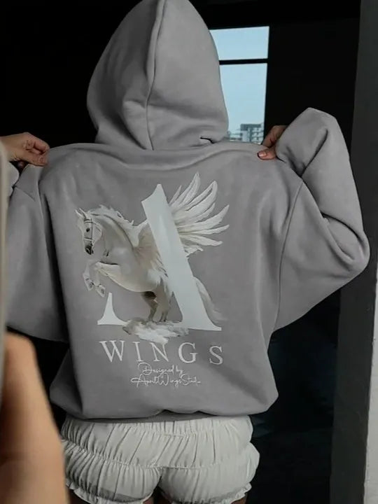 Kapuzenpulli mit Engelsflügel-Print | Urbaner Style mit romantischem Twist